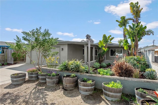 exterior space with fence and stucco siding