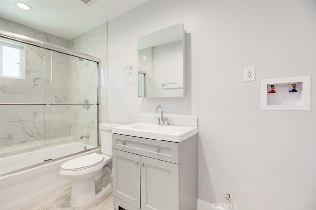 full bathroom with toilet, vanity, and shower / bath combination with glass door