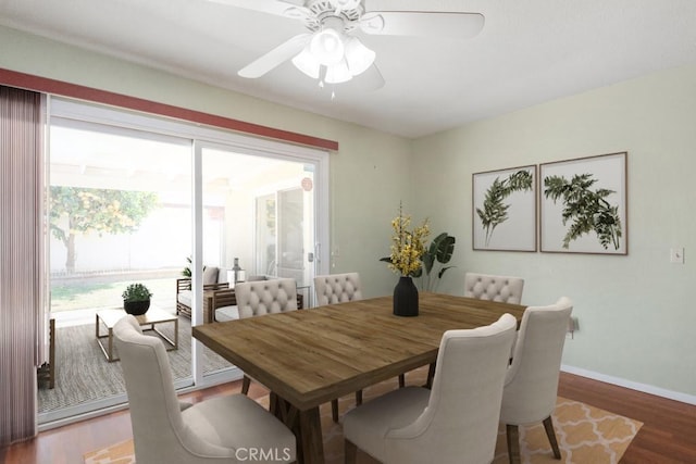 dining area with ceiling fan, baseboards, and wood finished floors