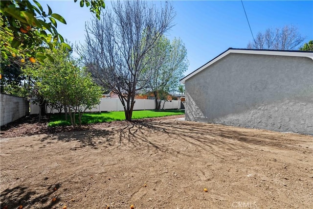 view of yard with a fenced backyard