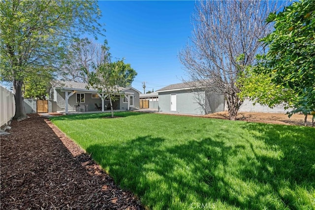 view of yard with a patio area and a fenced backyard