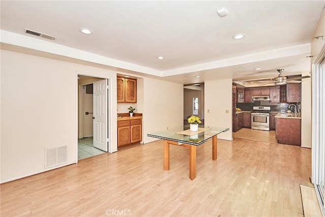 recreation room with recessed lighting, visible vents, and light wood-style flooring