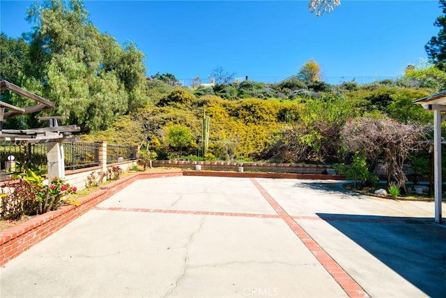 view of patio with fence