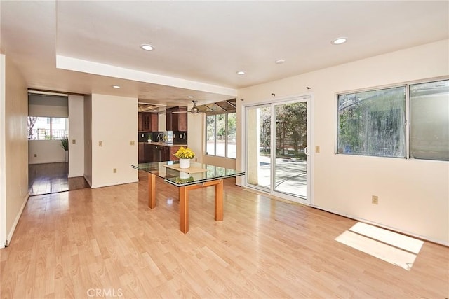 dining area with plenty of natural light, light wood-style floors, and recessed lighting