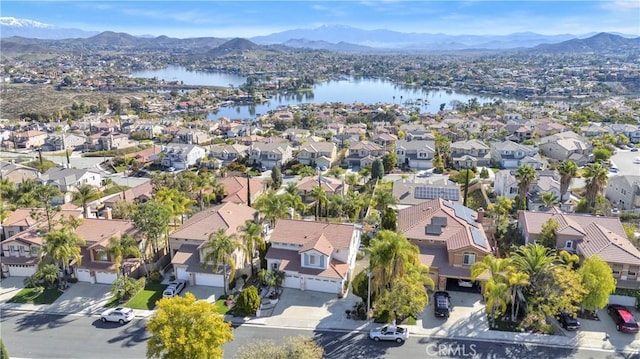 bird's eye view featuring a residential view and a water and mountain view