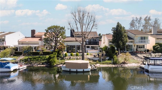 dock area featuring a residential view and a water view