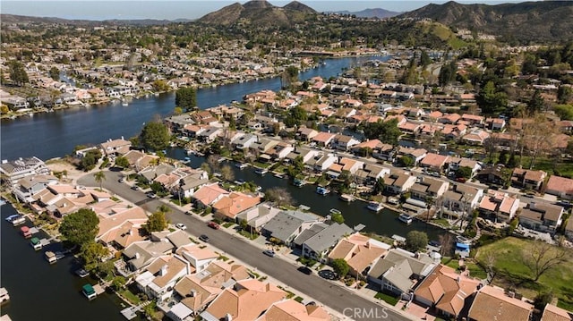 bird's eye view with a residential view and a water and mountain view