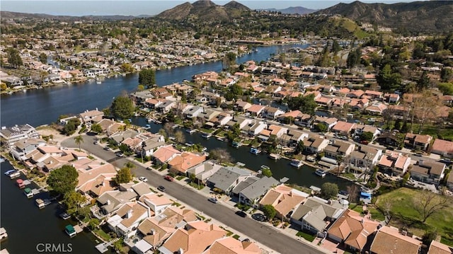 bird's eye view featuring a water and mountain view and a residential view