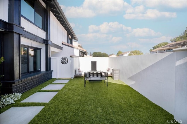 view of yard with a fenced backyard