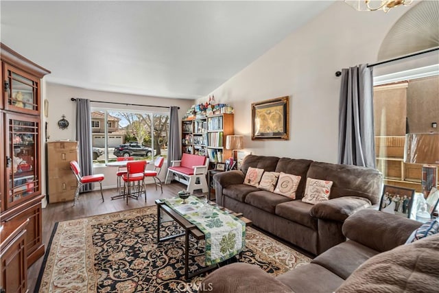 living area with wine cooler, wood finished floors, and vaulted ceiling