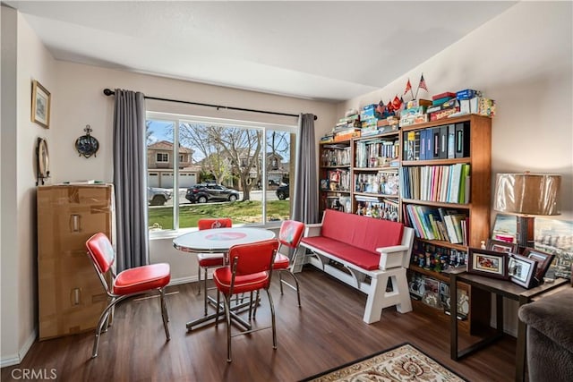 living area featuring wood finished floors and baseboards