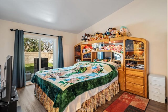 bedroom featuring dark wood finished floors and access to outside