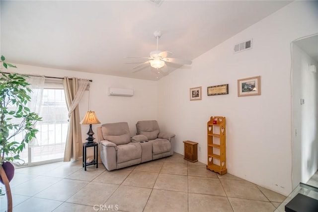 living area with visible vents, an AC wall unit, light tile patterned floors, ceiling fan, and vaulted ceiling