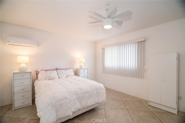 bedroom with light tile patterned floors, a ceiling fan, and a wall mounted AC