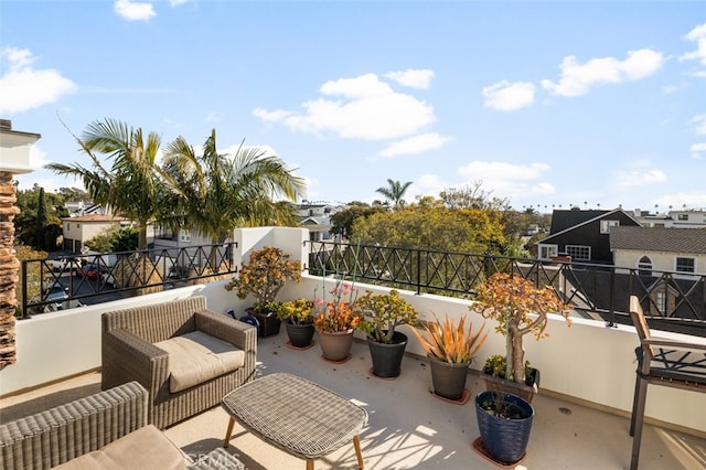 view of patio featuring a balcony