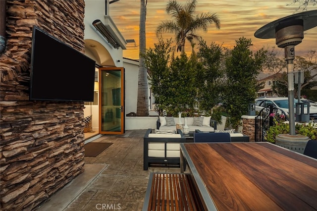 view of patio with outdoor dining space and an outdoor living space