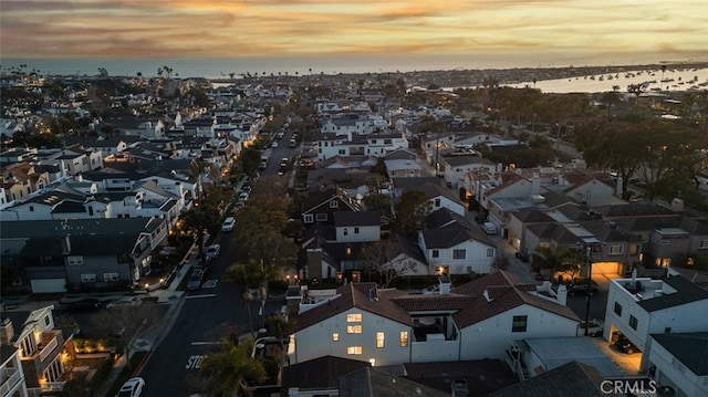 bird's eye view featuring a water view and a residential view