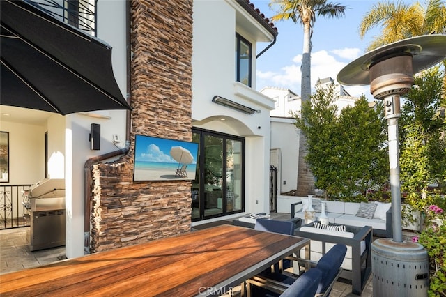 view of patio featuring an outdoor living space and outdoor dining area