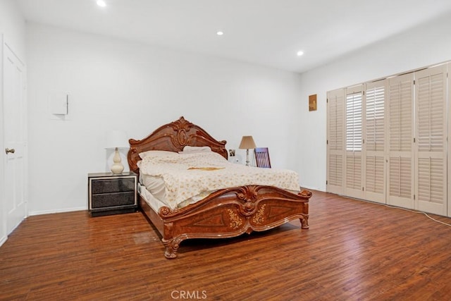 bedroom featuring recessed lighting, wood finished floors, and baseboards