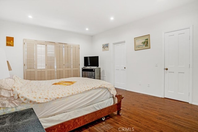 bedroom featuring recessed lighting, baseboards, and wood finished floors