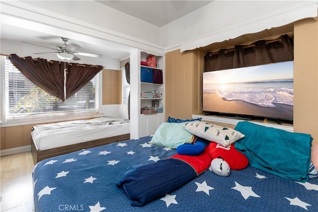 bedroom with wood finished floors