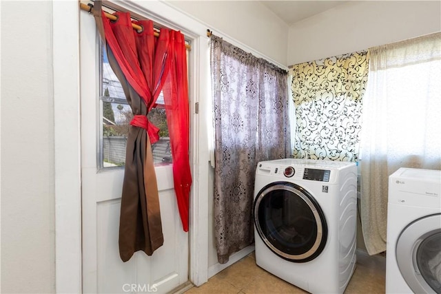 laundry area featuring washing machine and dryer and laundry area