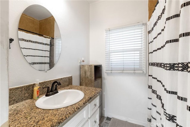 full bath featuring vanity and a shower with shower curtain