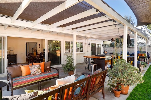 view of patio with an outdoor living space, outdoor dining area, and fence