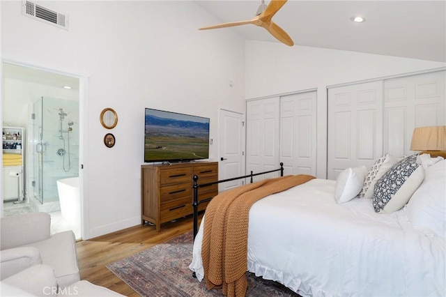 bedroom with visible vents, recessed lighting, multiple closets, ensuite bathroom, and light wood-type flooring