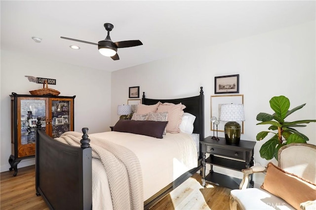 bedroom with recessed lighting, a ceiling fan, and light wood finished floors