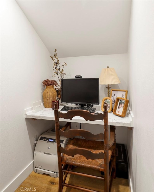 home office with wood finished floors and baseboards