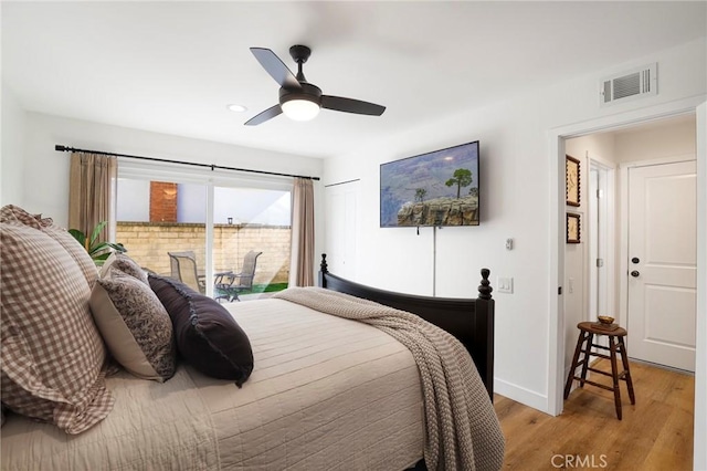 bedroom featuring access to exterior, visible vents, baseboards, ceiling fan, and light wood-style flooring