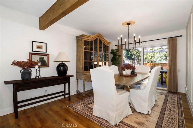 dining space featuring beam ceiling, a notable chandelier, baseboards, and wood finished floors