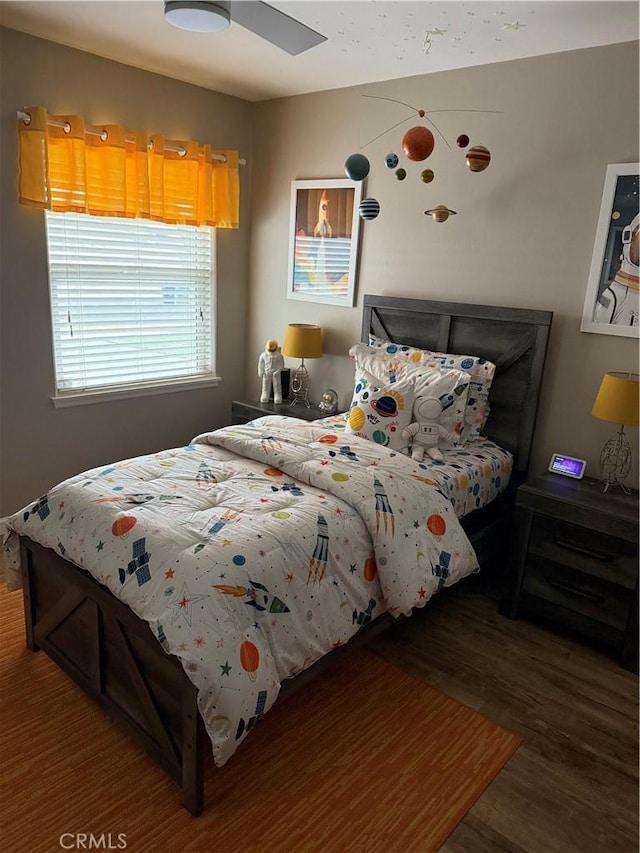 bedroom featuring wood finished floors