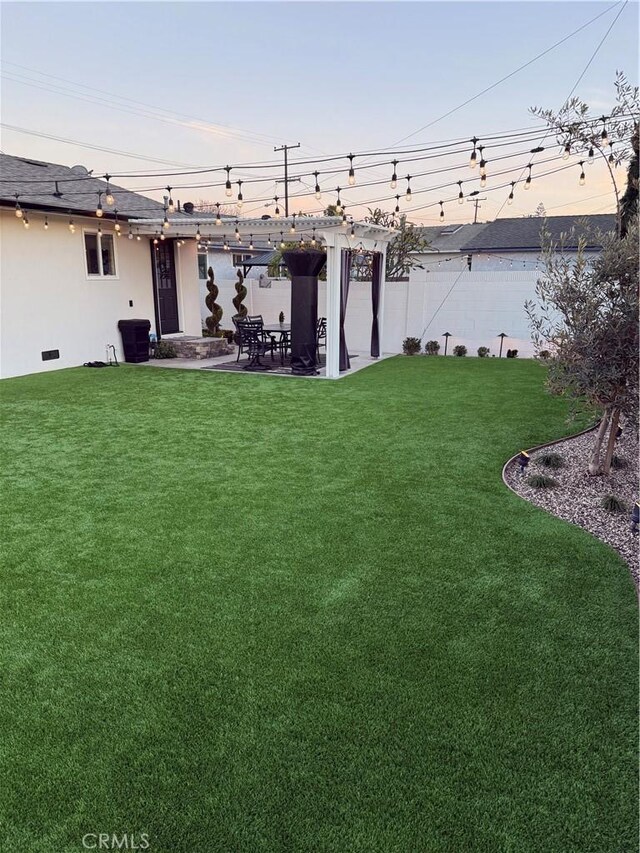 view of yard with fence and a patio area