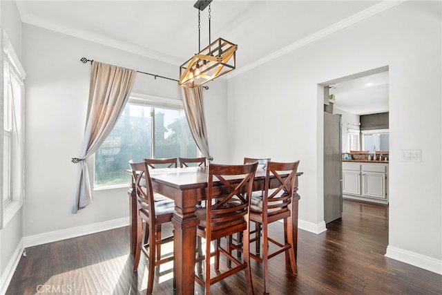 dining room with crown molding, baseboards, and dark wood-style flooring