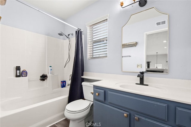 full bathroom featuring visible vents, toilet, shower / bath combo, wood finished floors, and vanity