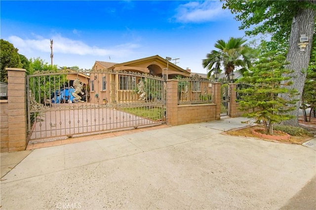 view of gate featuring a fenced front yard