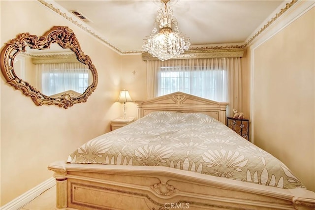 bedroom featuring a notable chandelier, visible vents, and baseboards