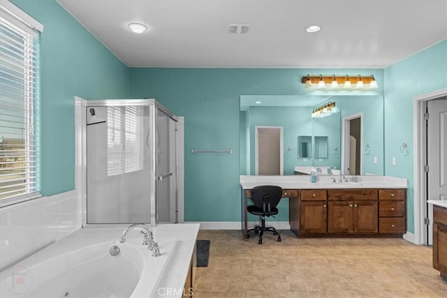 bathroom featuring visible vents, a stall shower, vanity, baseboards, and a whirlpool tub