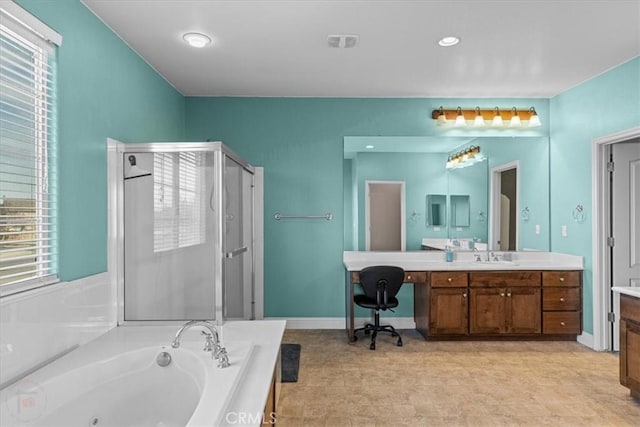 bathroom featuring visible vents, a shower stall, a jetted tub, baseboards, and vanity