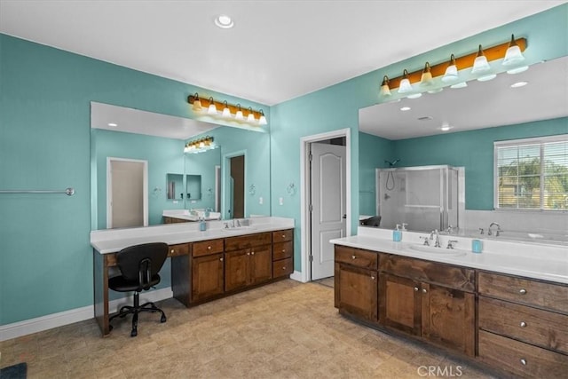 bathroom with walk in shower, vanity, and baseboards