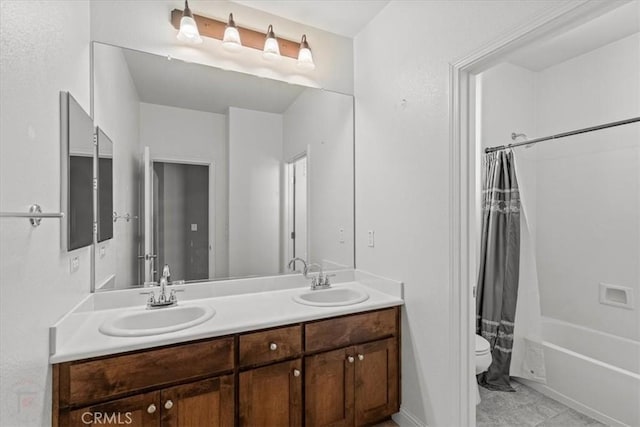 full bathroom with double vanity, shower / bath combination with curtain, toilet, and a sink