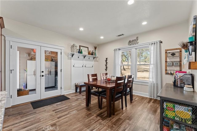 dining area featuring recessed lighting, french doors, visible vents, and wood finished floors