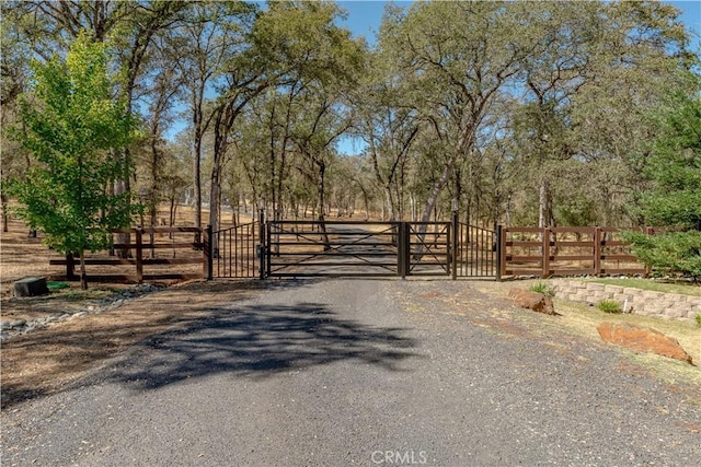 view of gate featuring fence