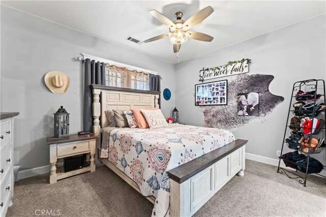 bedroom with visible vents, light carpet, baseboards, and ceiling fan