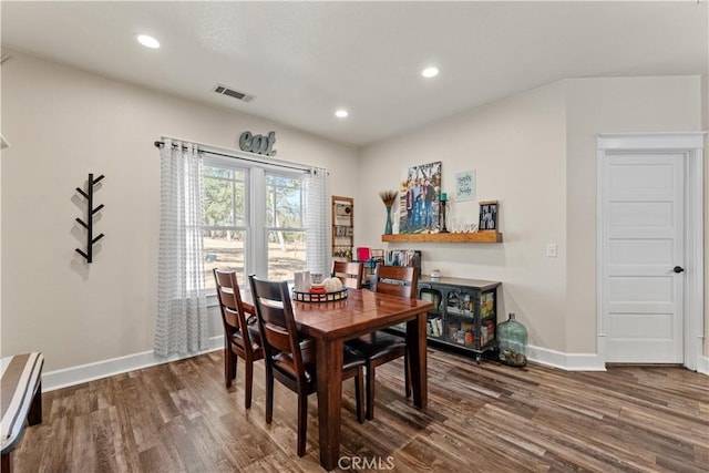 dining room featuring recessed lighting, wood finished floors, visible vents, and baseboards