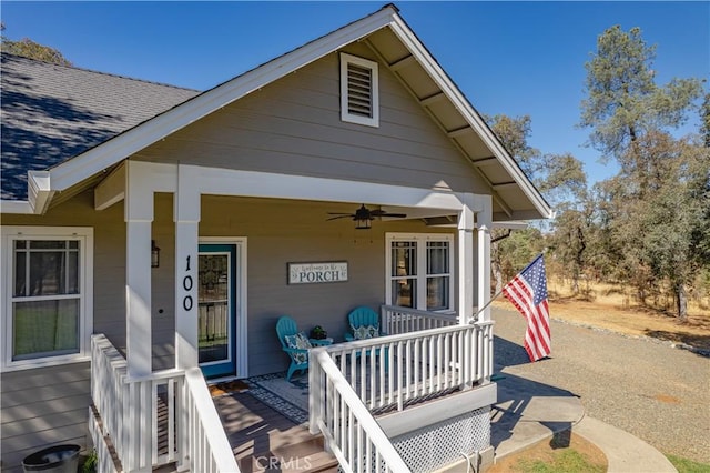 exterior space featuring a porch, a shingled roof, and ceiling fan