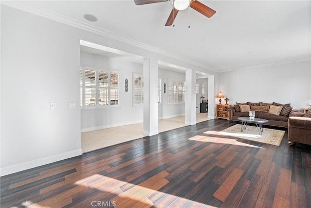 living room featuring ceiling fan, baseboards, hardwood / wood-style floors, and ornamental molding