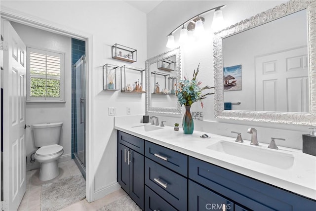 bathroom with toilet, a stall shower, and a sink